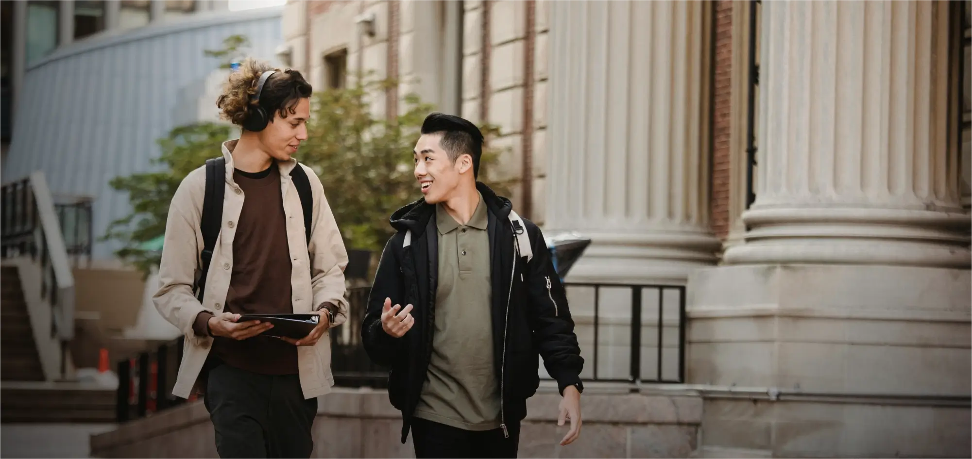 Two students walking on campus